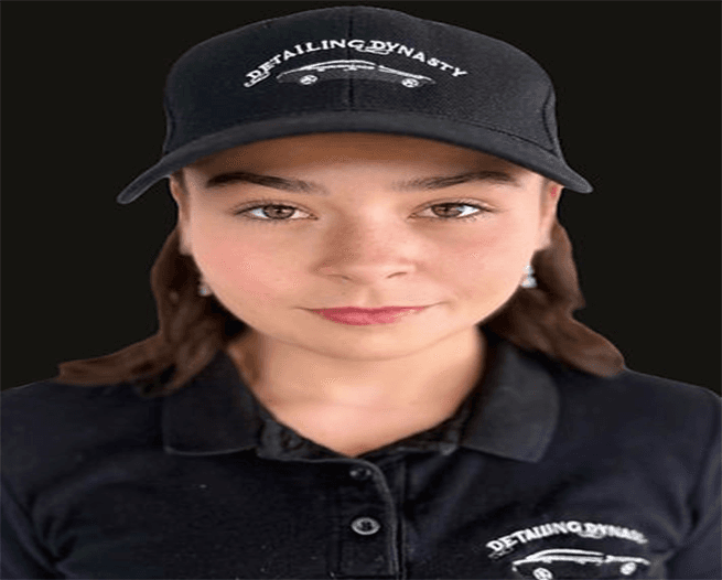 Detailing Dynasty team member working on a vehicle interior